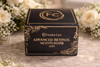 Faciala Care Advanced Retinol Moisturizer box surrounded by white flowers on a marble surface.